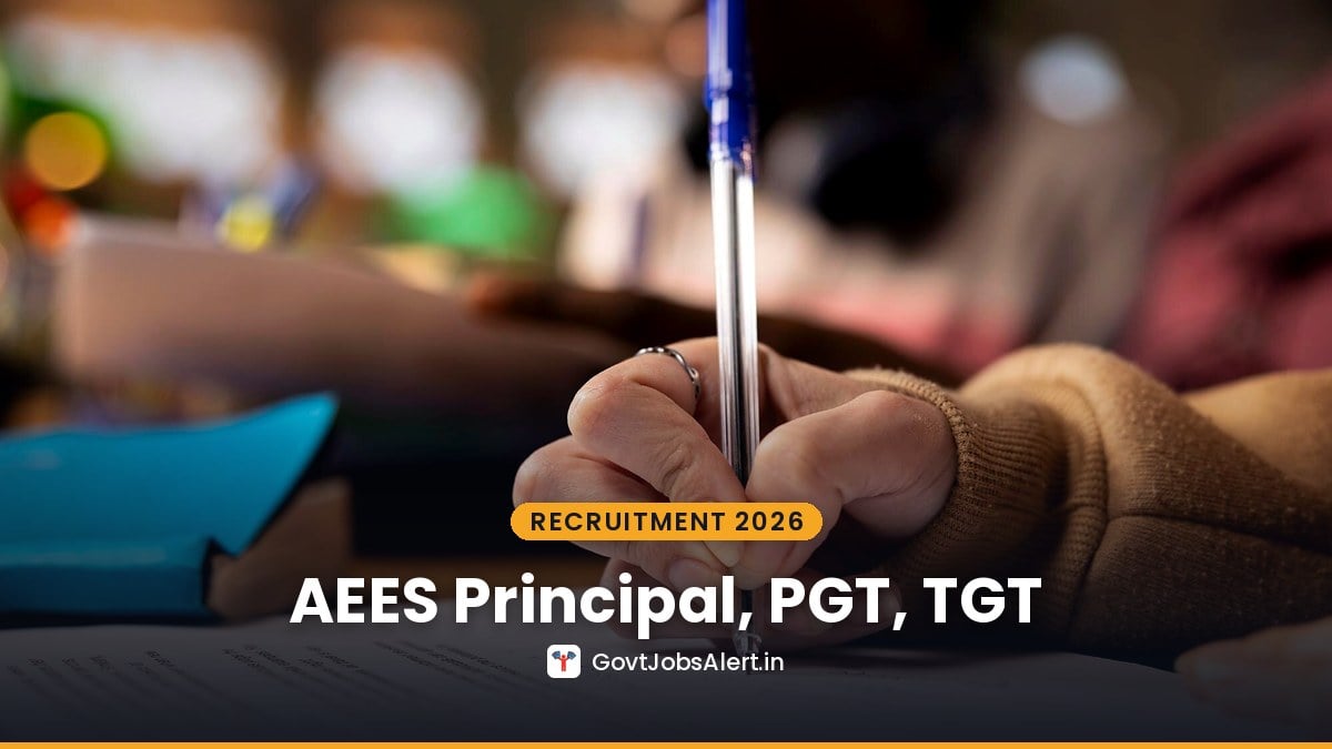 Candidate writing with a pen on paper while preparing for AEES Teaching Recruitment 2026 Principal, PGT, TGT and other posts