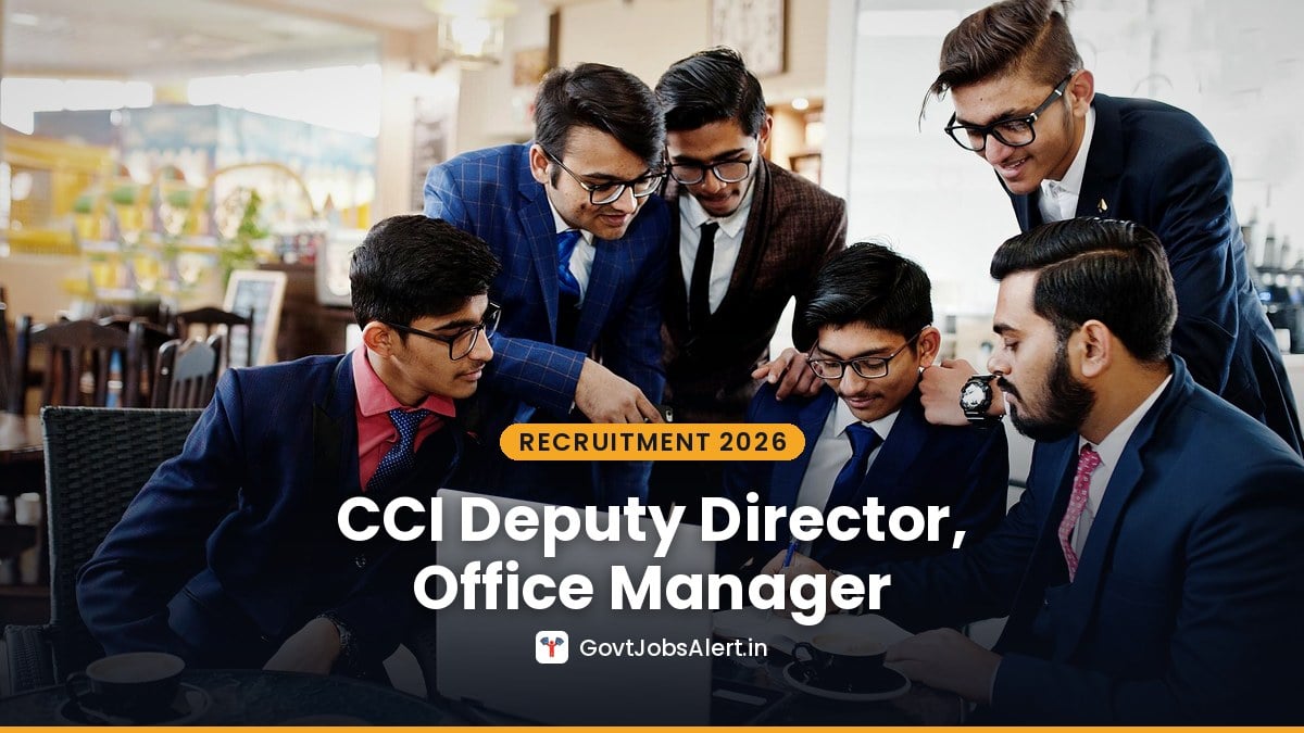 Indian officers in suits discussing work over a laptop - CCI Deputy Director, Office Manager and Other Posts Deputation Recruitment 2026