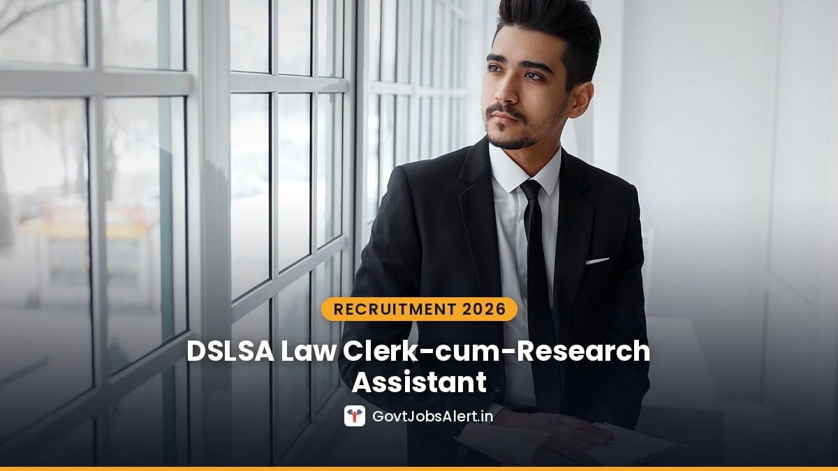 Young law graduate with a book by a window for DSLSA Law Clerk-cum-Research Assistant Recruitment 2026 in Delhi