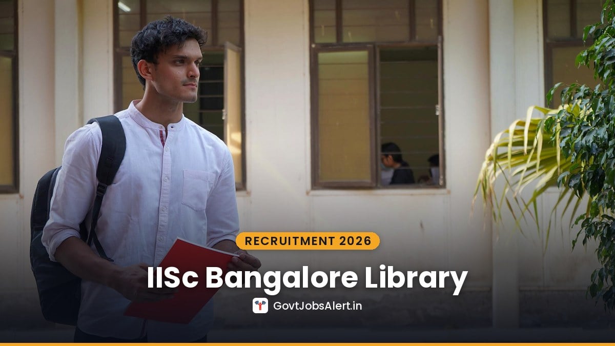 A student with a backpack holding a red notebook outside a college building - IISc Bangalore LIM Project Trainee Recruitment 2026