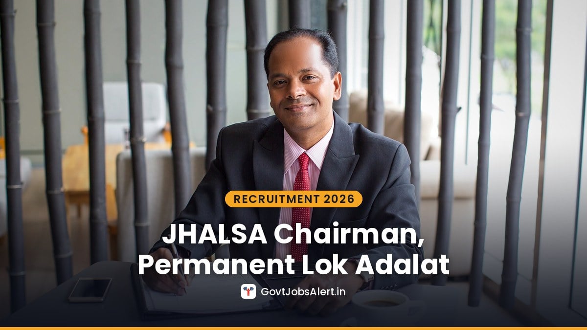 Indian man in a suit filling in a form at a table — JHALSA Chairman Permanent Lok Adalat Recruitment 2026