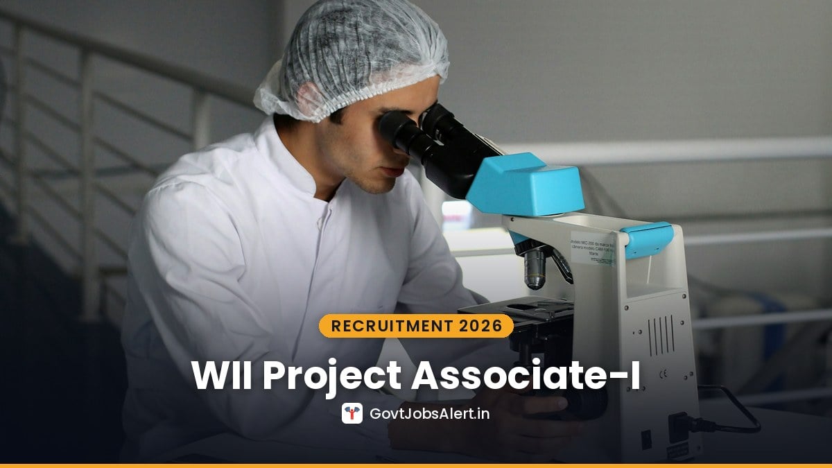 Researcher using a microscope in a lab for WII Recruitment 2026 project posts at Wildlife Institute of India